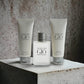 Acqua di Giò Duftset mit Parfum, Aftershave und Duschgel vor Betonhintergrund