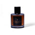 Braune Gisada Eau de Parfum Flasche mit schwarzem Etikett und Deckel auf weißem Hintergrund