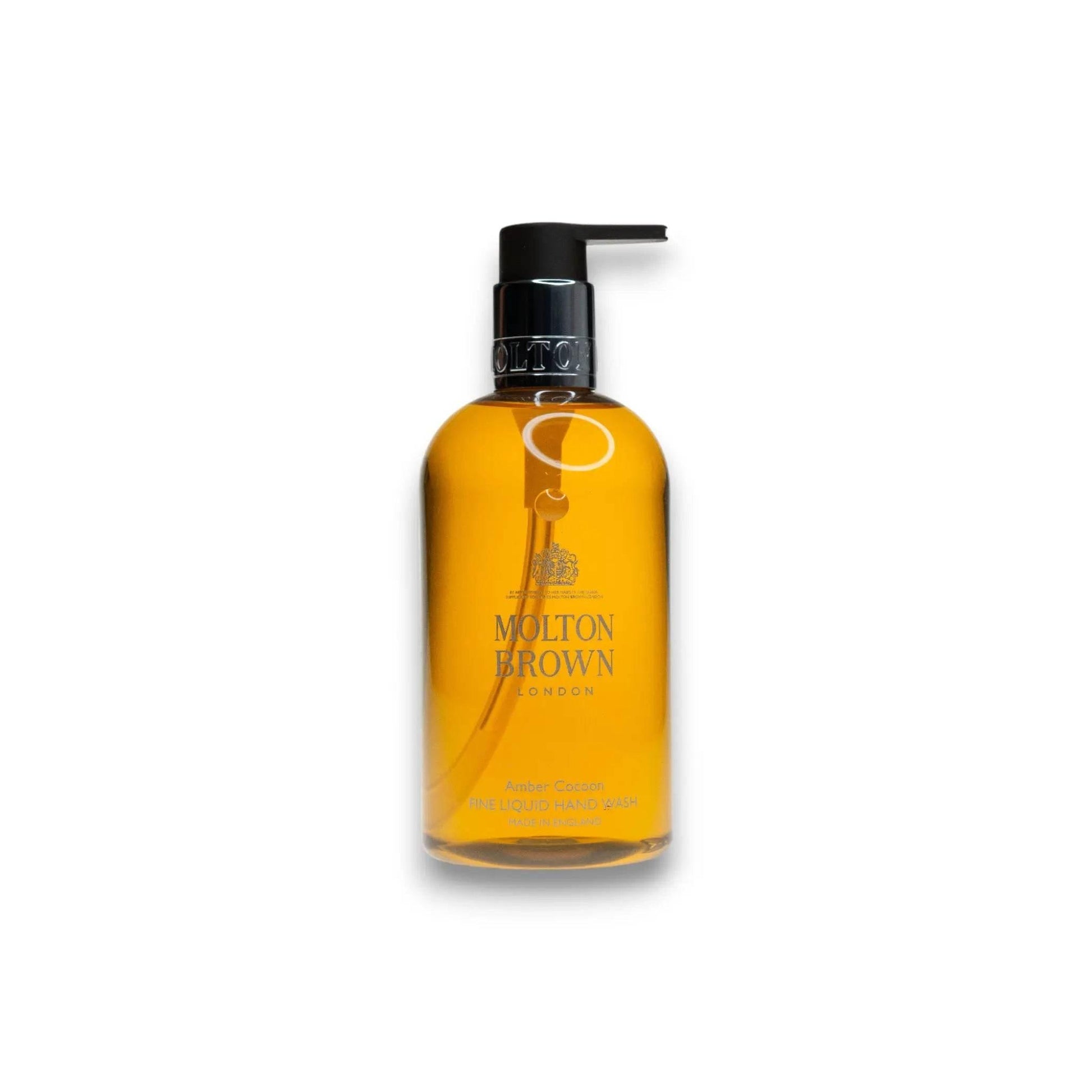 Molton Brown Amber Cocoon Handseife in transparentem Pumpspender, goldene Flüssigkeit