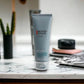 BIOTHERM HOMME Basics Line Cleanser, Gesichtsreiniger Tube auf Marmortisch im Bad