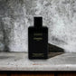 Schwarze Flasche Chanel Coco feuchtigkeitsspendende Body Lotion auf Marmoruntergrund