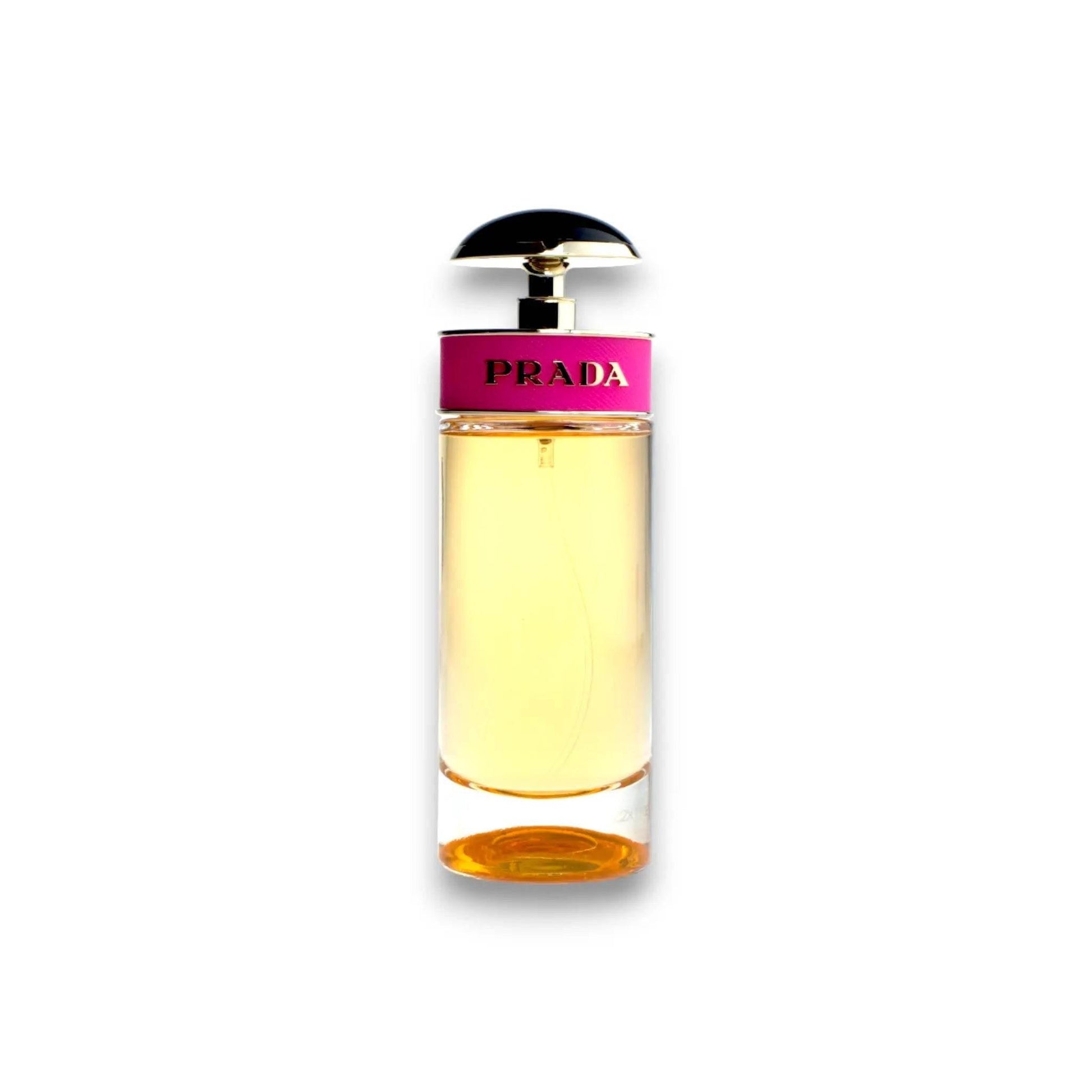 Glasflakon mit goldenem Parfum, schwarzer Deckel, pinkes Etikett mit Aufschrift PRADA