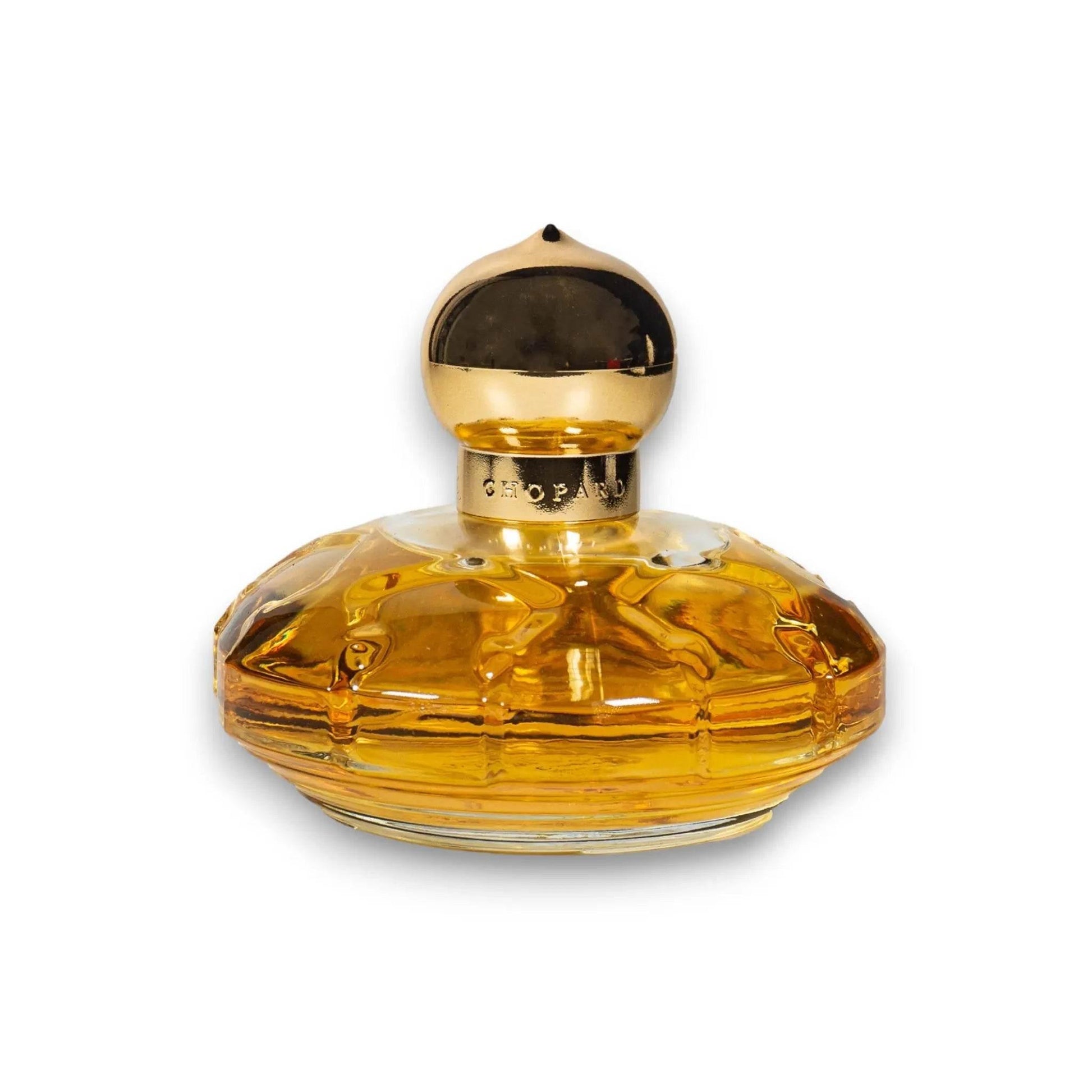 Luxus Parfumflakon mit goldener Kappe und bernsteinfarbenem Glas, elegantes Design