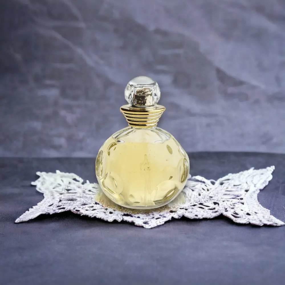 Runder Flakon Eau de Toilette mit goldenem Verschluss auf Spitze, luxuriöses Parfum