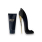 Good Girl Duftset mit Body Lotion und Parfumflakon in High Heel Form auf weißem Hintergrund
