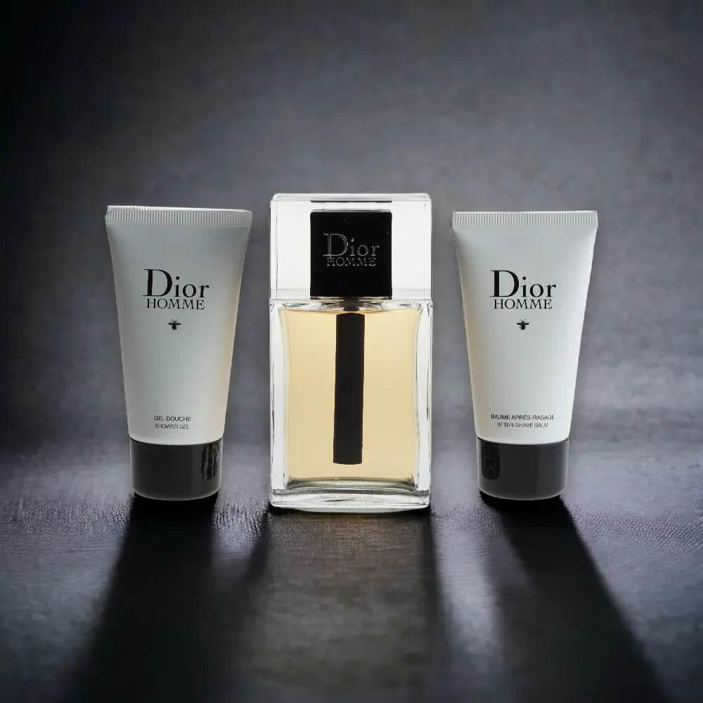 Dior Homme Duftset mit Eau de Toilette, Duschgel und Aftershave Balsam auf dunklem Hintergrund