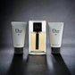 Dior Homme Duftset mit Eau de Toilette, Duschgel und Aftershave-Balsam auf dunklem Hintergrund