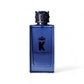 Blauer Parfumflakon mit Krone, Aufschrift K und Eau de Parfum, vor weißem Hintergrund.