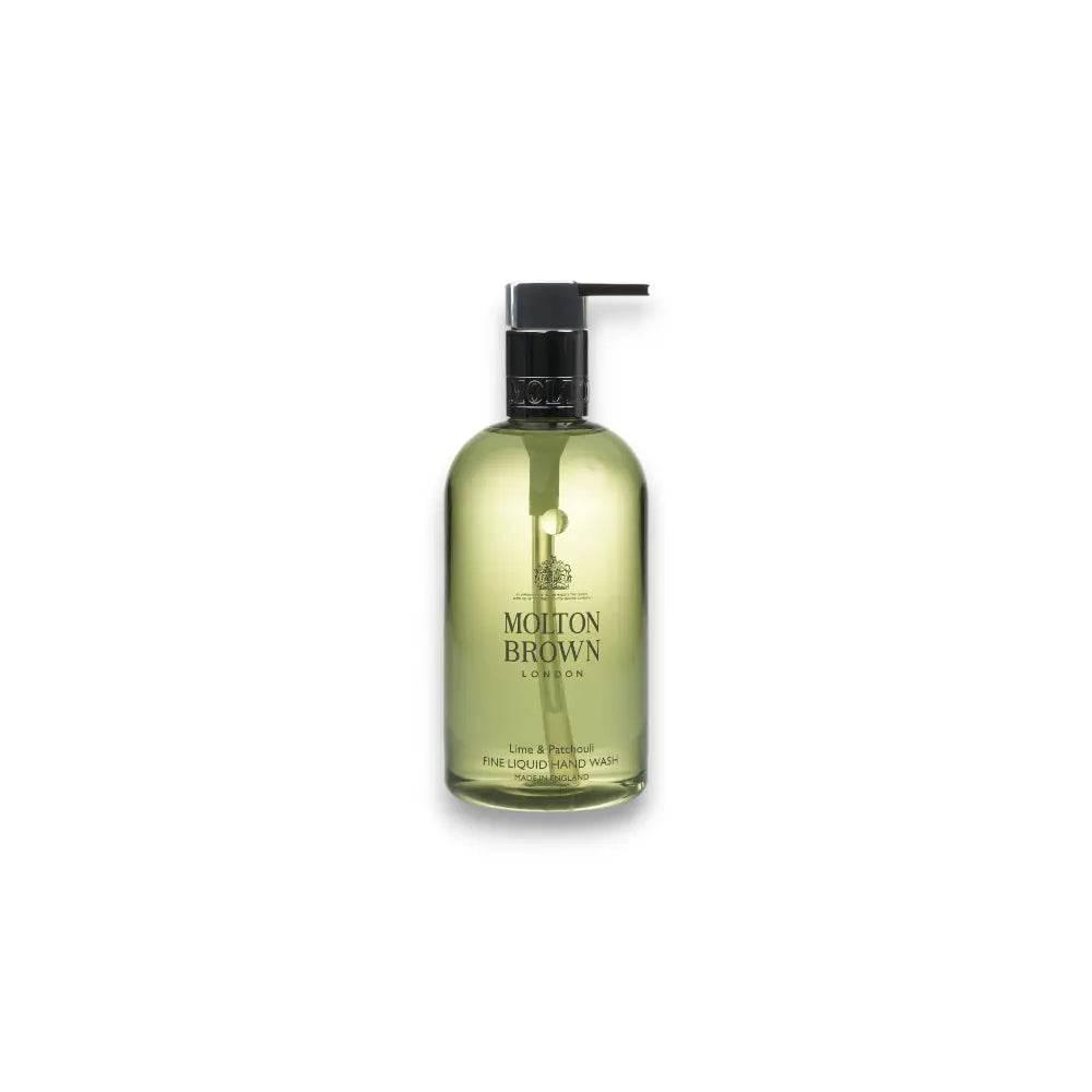 Transparente Pumpflasche mit grüner Handseife, Aufschrift Lime & Patchouli sichtbar
