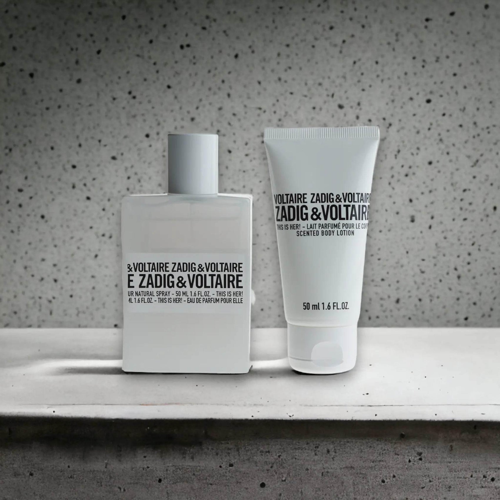 Zadig & Voltaire Duftset mit Eau de Parfum und Body Lotion auf grauem Hintergrund