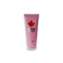 Pinkfarbene Tube Wood Charming Bath & Shower Gel, dekoriert mit rotem Ahornblatt, freigestellt.