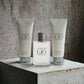 Acqua di Giò Duftset mit Eau de Toilette, Duschgel und Aftershave vor Betonhintergrund