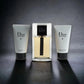 Dior Homme Duftset mit Eau de Toilette, Duschgel und Aftershave-Balsam auf dunklem Hintergrund