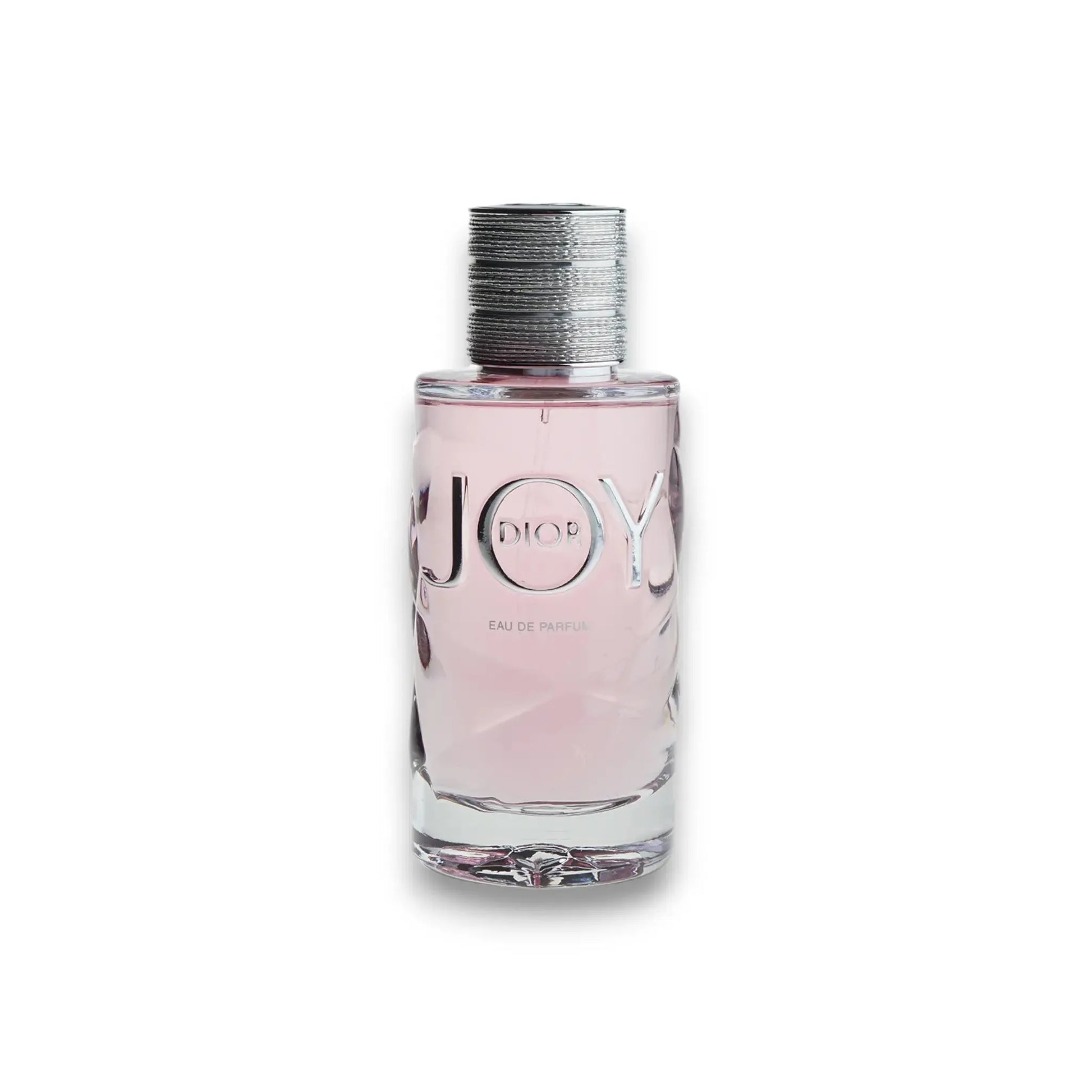 Joy by Dior Eau de Parfum Flakon mit rosafarbenem Duft auf weißem Hintergrund