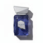 Blauer Atlantis Extrait Parfum Flakon mit silbernem Verschluss auf weißem Hintergrund