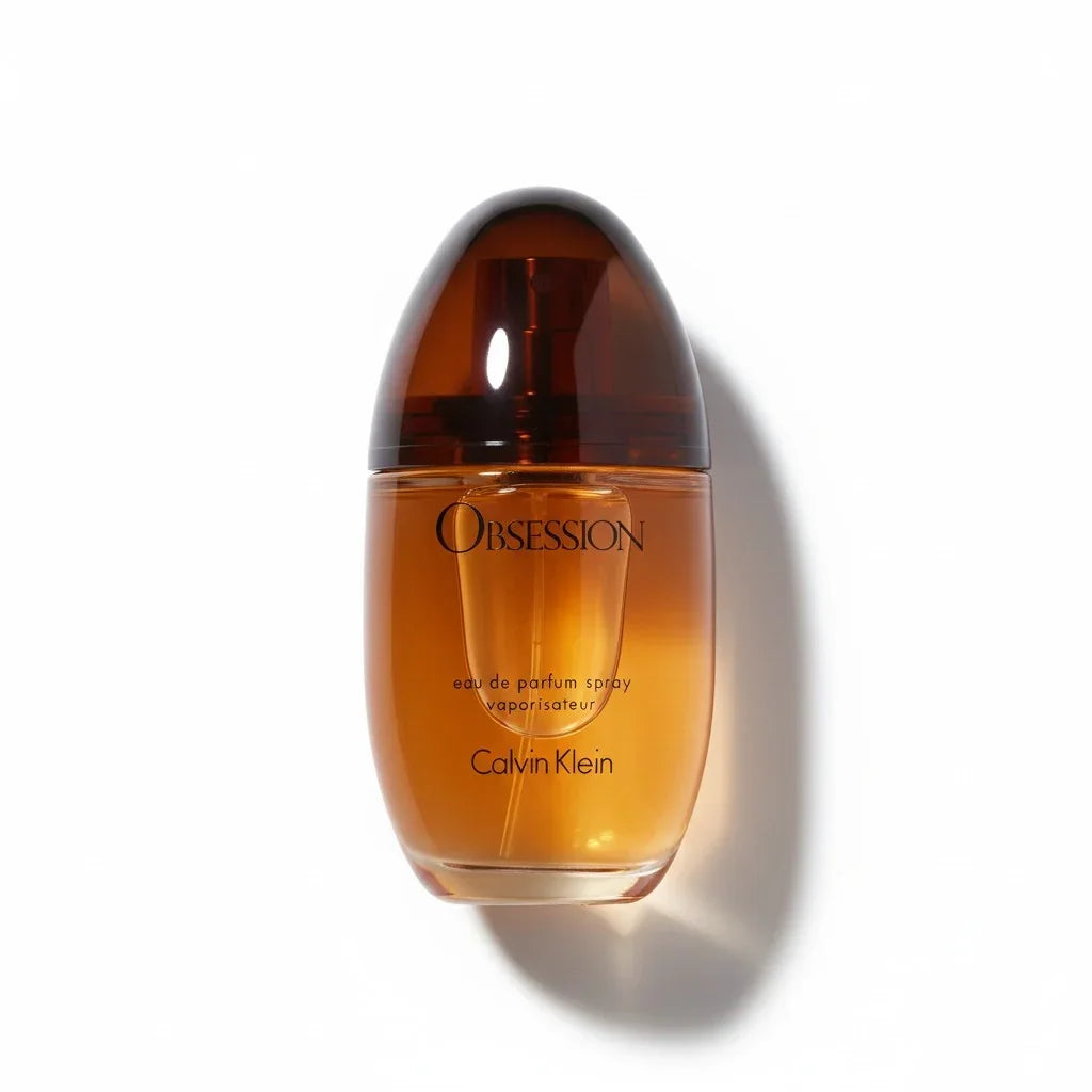 Calvin Klein Obsession Eau de Parfum Spray Flakon in Bernsteinfarbe auf weißem Hintergrund